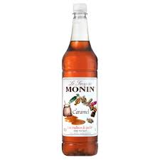 Monin Caramel Syrup bottle with clear color that shows off the brown colored caramel syrup from Saudi Supplier.